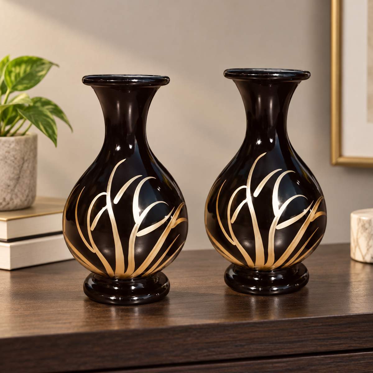 Noir Bloom black and gold decorative vase set styled on a dark wood shelf