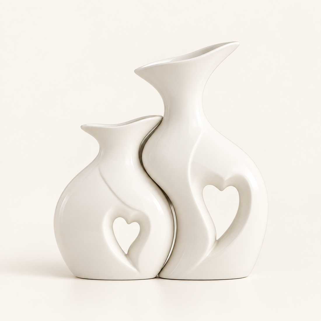 Amora sculptural white ceramic vase set of two with heart cut-outs on warm ivory