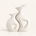 Amora sculptural white ceramic vase set of two with heart cut-outs on warm ivory