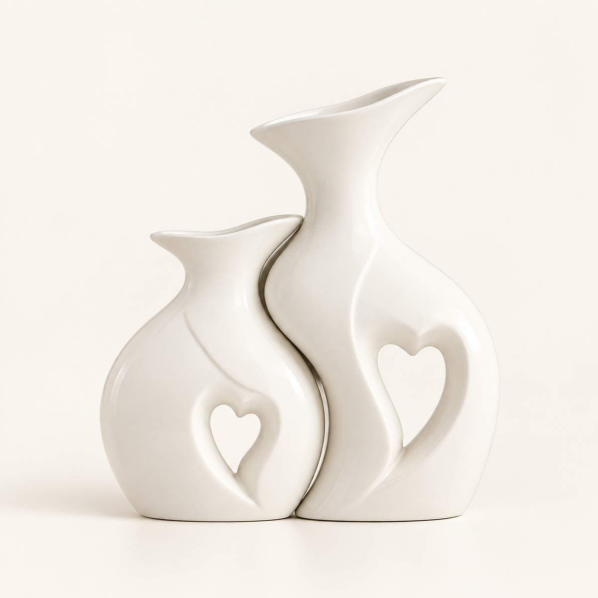 Amora sculptural white ceramic vase set of two with heart cut-outs on warm ivory