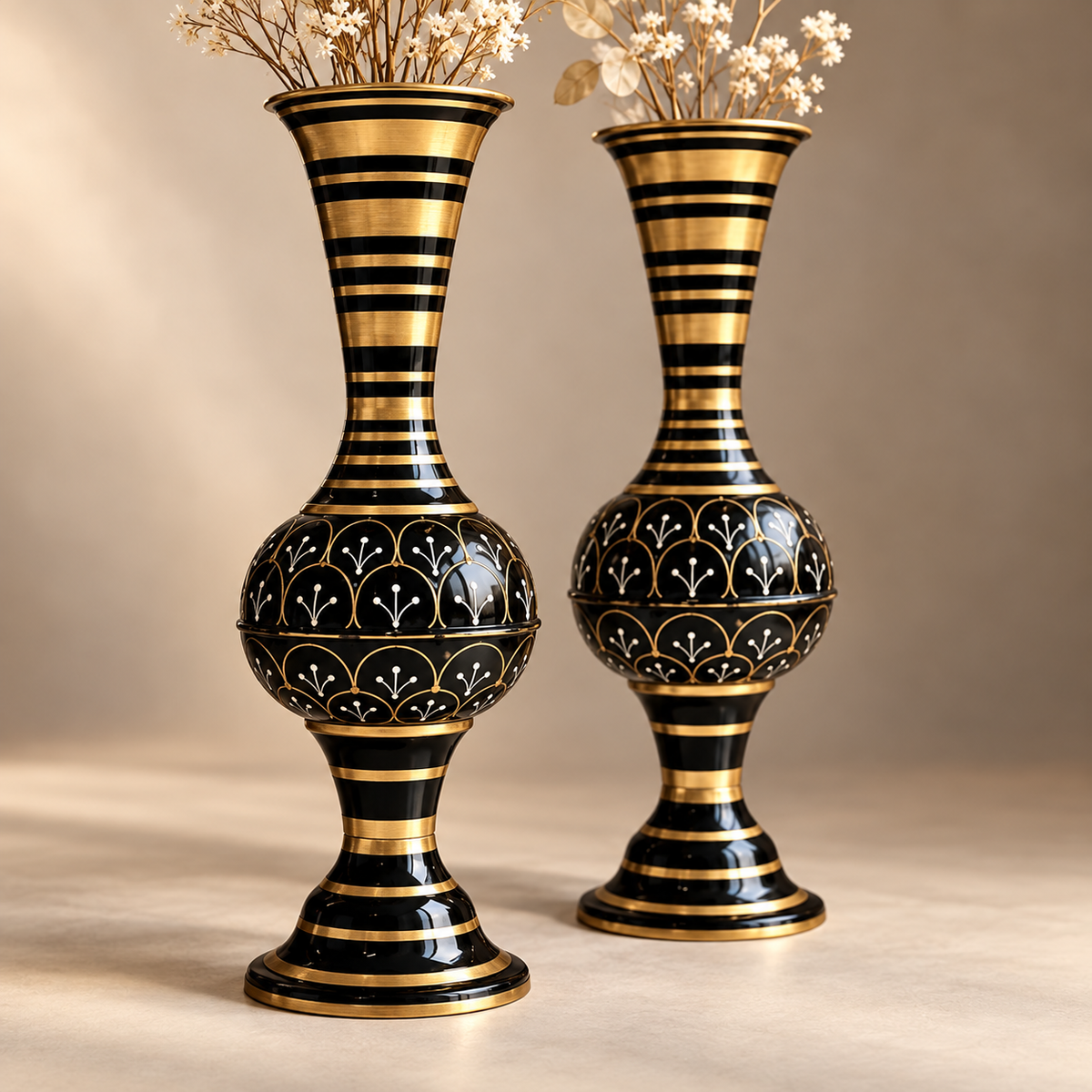 Close detail of the Aurelia black and gold iron floor vase set and painted floral motifs