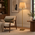 VIRAAM Aurelia brass floor lamp in a warm reading corner
