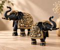 Close detail of ornate antique gold relief work on the Aurum Gaja elephant figurines