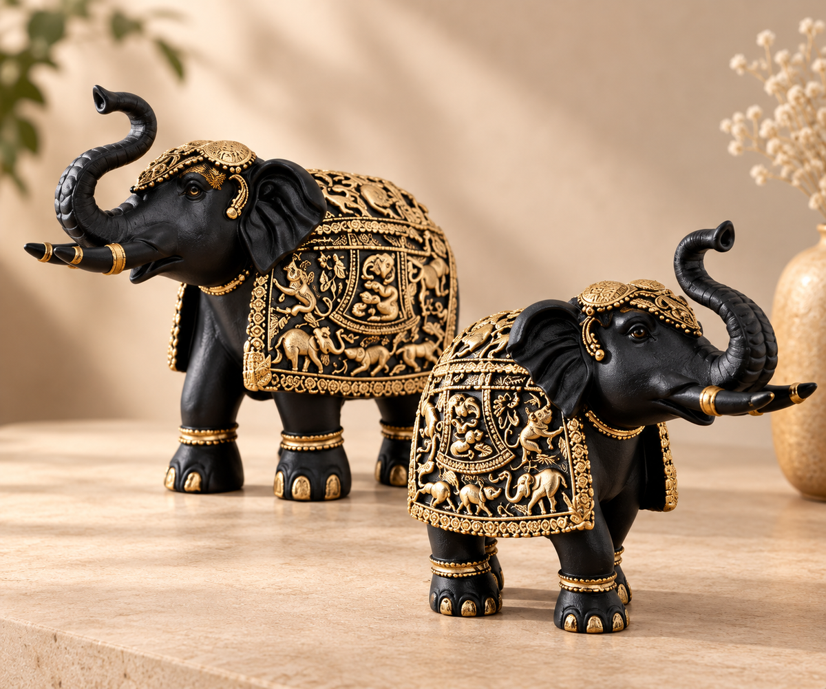 Close detail of ornate antique gold relief work on the Aurum Gaja elephant figurines