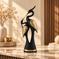 Eternal Grace crane couple sculpture styled in a warm beige and walnut luxury interior