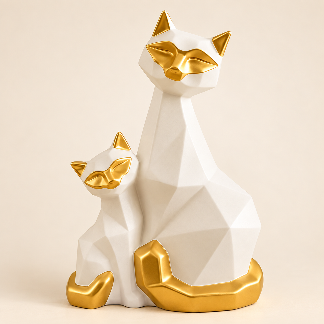White and gold geometric porcelain cat duo figurine on an ivory background