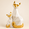 White and gold geometric porcelain cat duo figurine on an ivory background