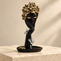 The Gilded Silence black and gold resin face sculpture