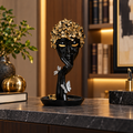 Luxury black resin face sculpture displayed in an office