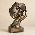 Three-quarter view of the Golden Serenity resin sculpture and textured finish