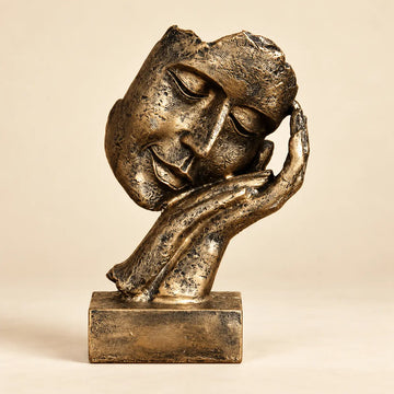 Golden Serenity antique-gold resin face sculpture on a warm ivory background