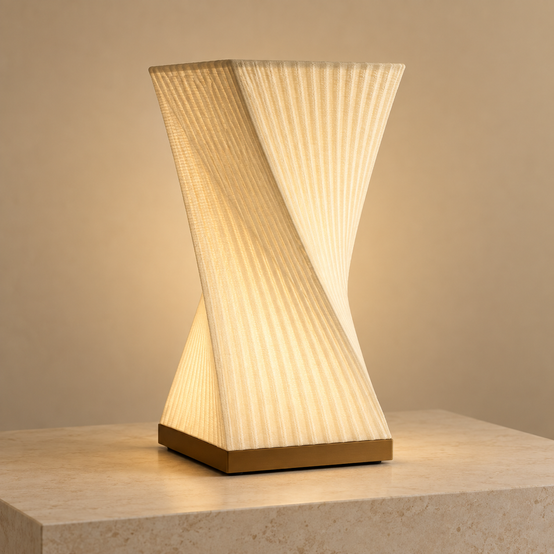 Helix Glow off-white 3D-printed sculptural table lamp illuminated on a stone plinth