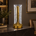 Gold acrylic LED table lamp in cool white mode