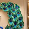 Close-up of blue and green feather detailing on peacock metal wall art