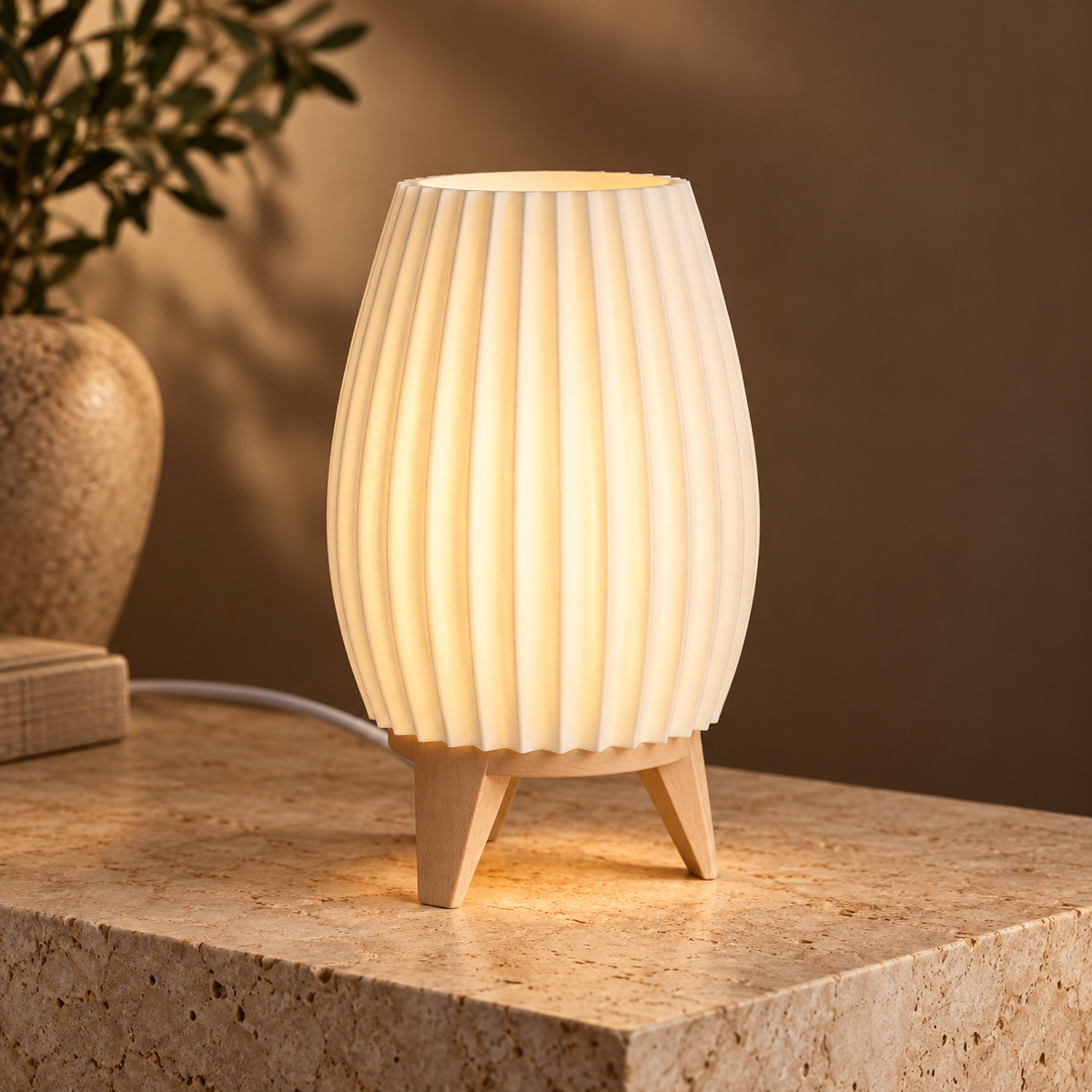 Off-white ribbed 3D-printed lamp with wooden tripod legs